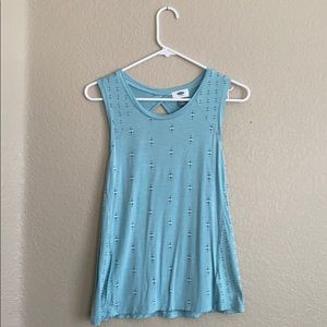 Sleeveless blue shirt w/ black & white detailing